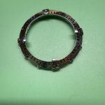 Losgenomen bezel van de Breitling Colt