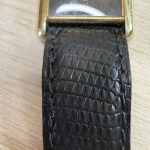 Voorzijde, band en nieuw glas van de Cartier